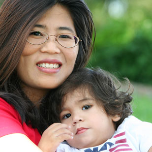 Smiling mother with child