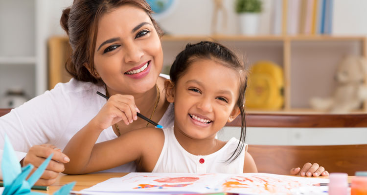Woman and young girl painting
