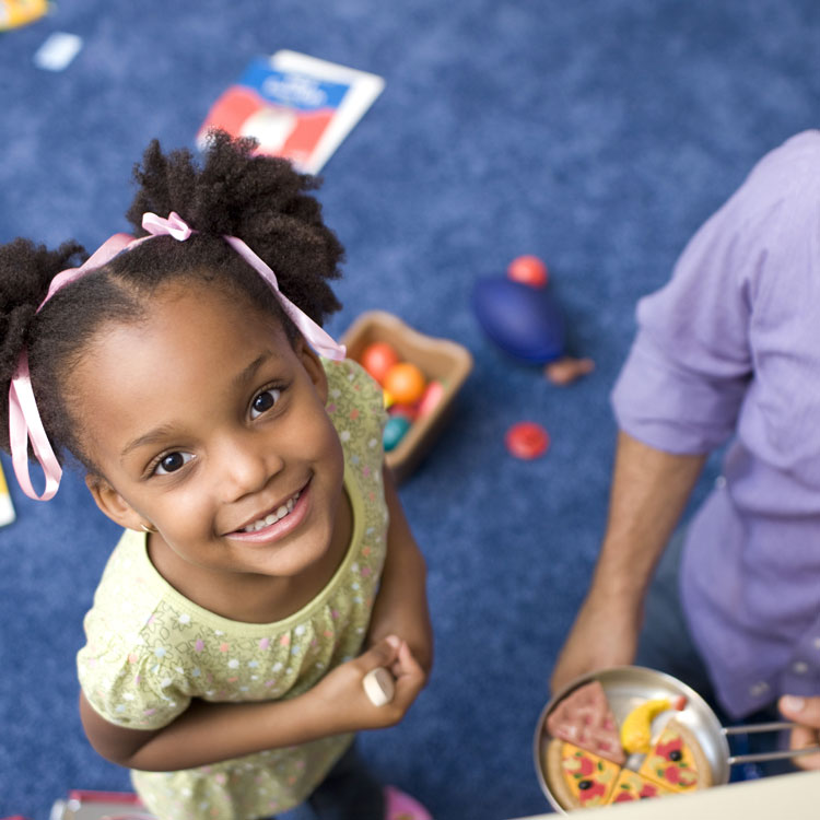 Young black girl looking up at the camera