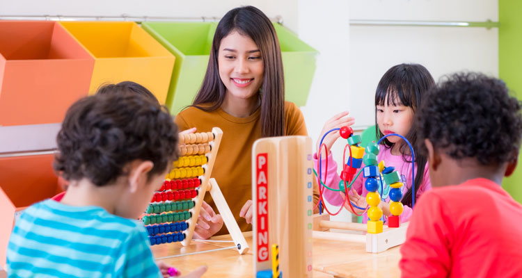 Teacher and toddlers in daycare